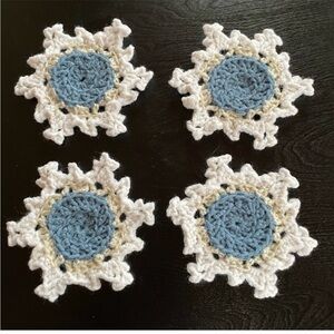 NWT crocheted steel blue center, snowflake coasters set of four
